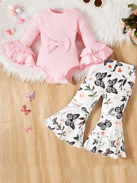 Get your little one ready for fall with this cute 2-piece outfit set featuring a solid color rib knit flare romper and flower print flare pants.